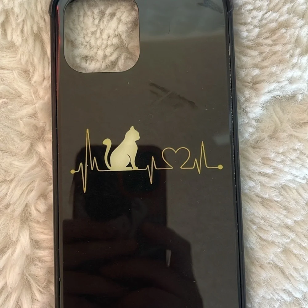 iPhone 12 phone cover preowned but hardily used perfect condition black cover